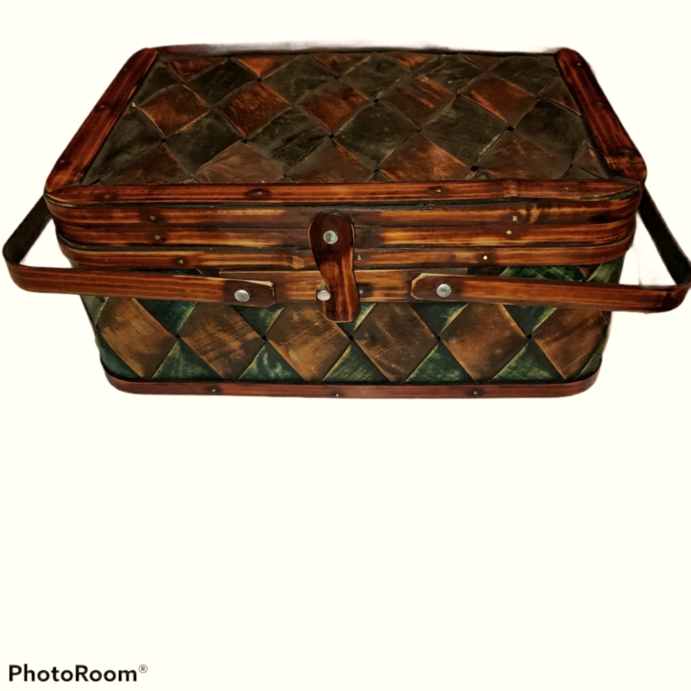Vintage woven wooden picnic basket featuring a green and brown checkered pattern